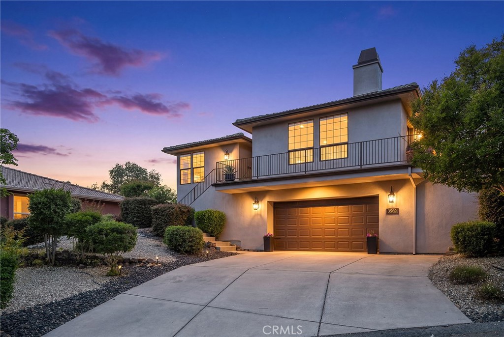 3560 Shadowtree Lane Chico, CA 95928 - Photo 2 of 52 a front view of a house with a yard and garage
