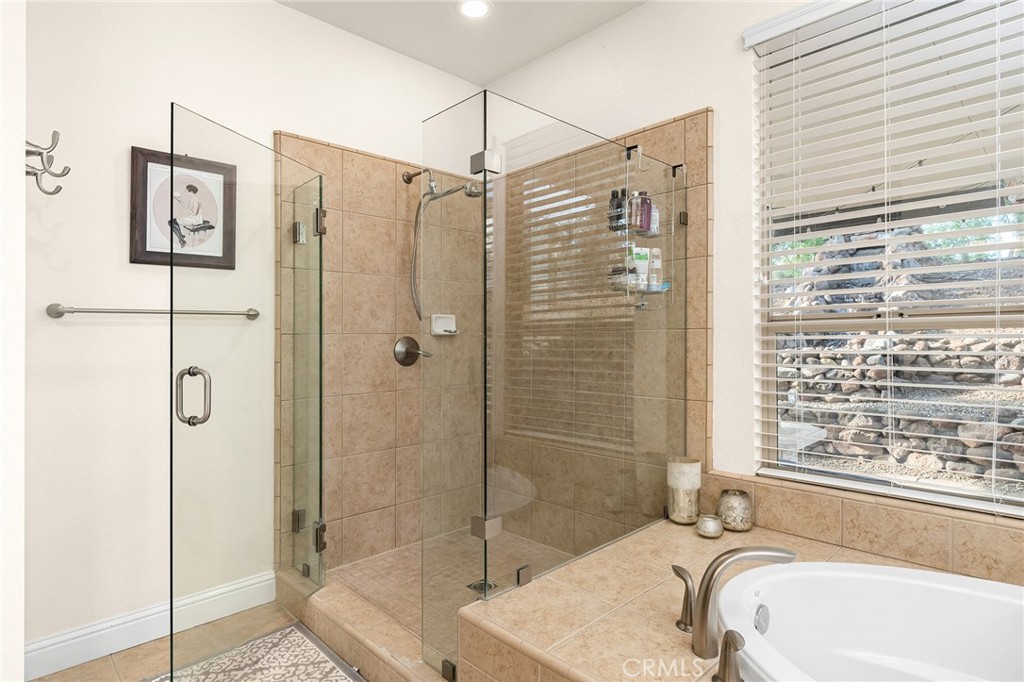 3560 Shadowtree Lane Chico, CA 95928 - Photo 22 of 52 a bathroom with a tub shower and sink