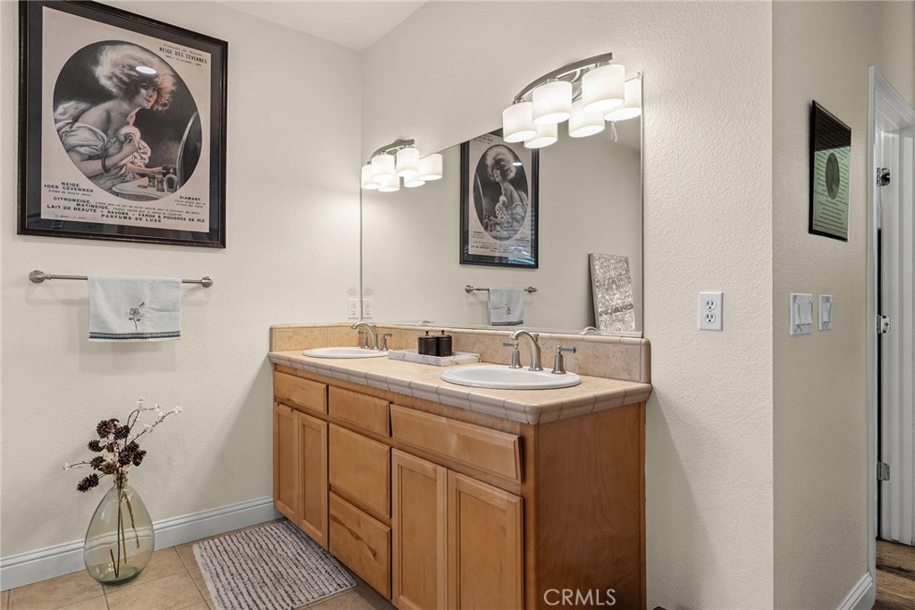 3560 Shadowtree Lane Chico, CA 95928 - Photo 24 of 52 a bathroom with a sink and mirror