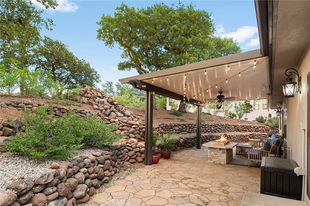 3560 Shadowtree Lane Chico, CA 95928 - Photo 33 of 52 a view of a patio with table and chairs and potted plants