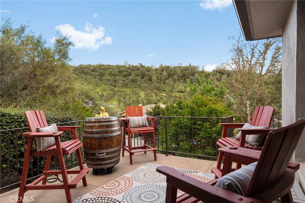 3560 Shadowtree Lane Chico, CA 95928 - Photo 40 of 52 a balcony with wooden floor table and chairs