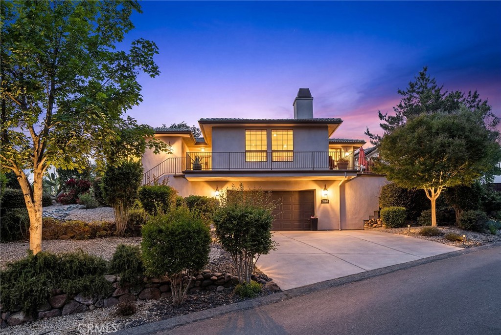 3560 Shadowtree Lane Chico, CA 95928 - Photo 49 of 52 a front view of a house with yard and trees