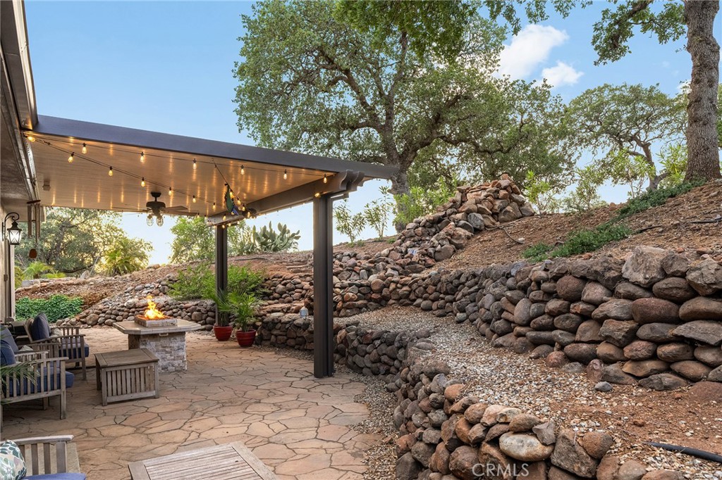 3560 Shadowtree Lane Chico, CA 95928 - Photo 6 of 52 a view of a patio with a table and chairs under an umbrella