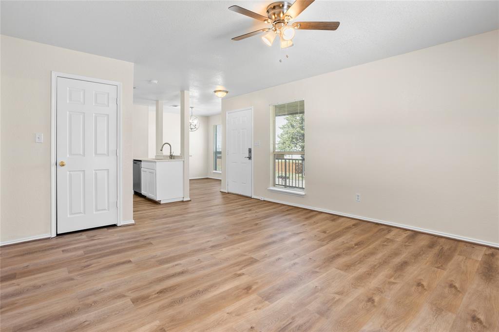 753 Olive Branch Road Weatherford, TX 76087 - Photo 12 of 21 wooden floor in an empty room with a window