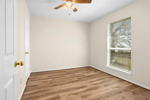 a view of room with window and hardwood floor