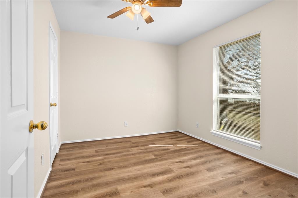 753 Olive Branch Road Weatherford, TX 76087 - Photo 18 of 21 a view of room with window and hardwood floor