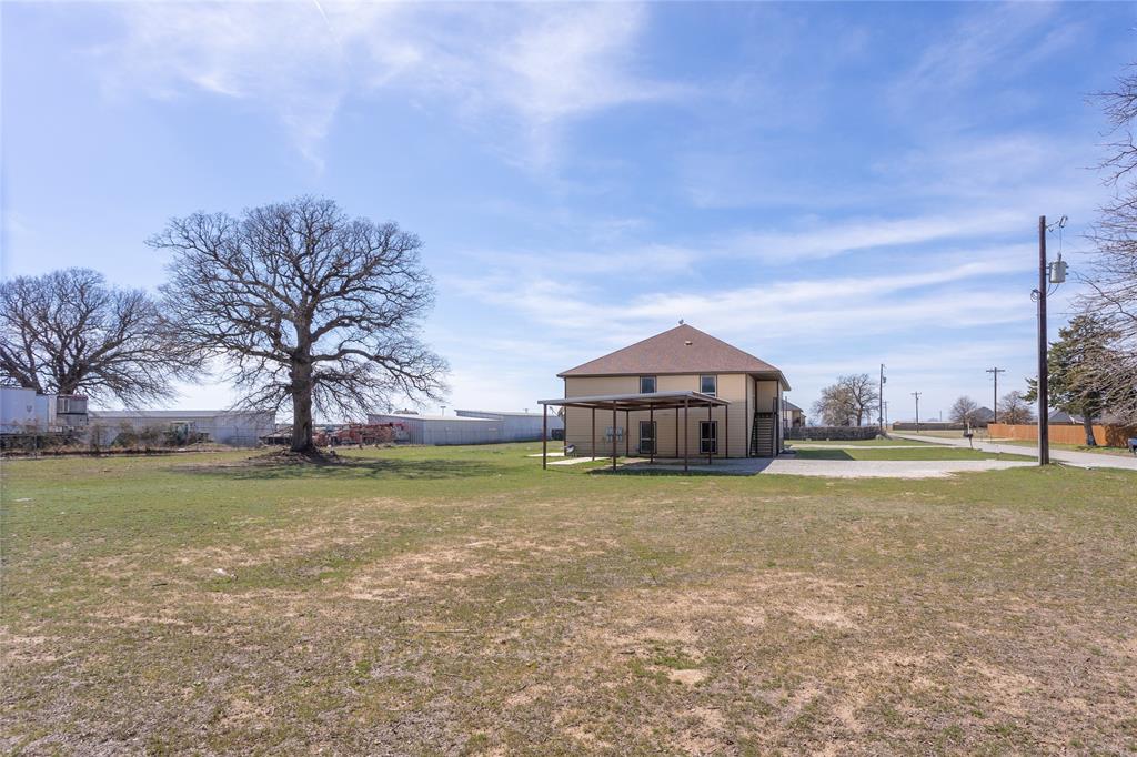 753 Olive Branch Road Weatherford, TX 76087 - Photo 20 of 21 a big house with a big yard and large trees