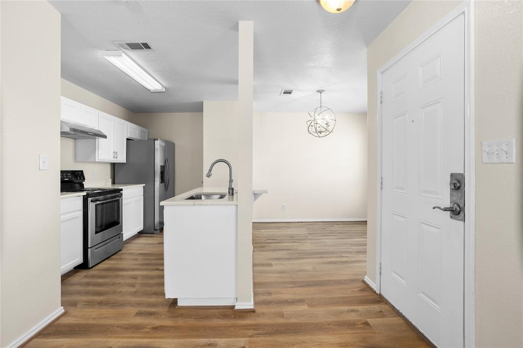 753 Olive Branch Road Weatherford, TX 76087 - Photo 5 of 21 a view of kitchen with sink and refrigerator