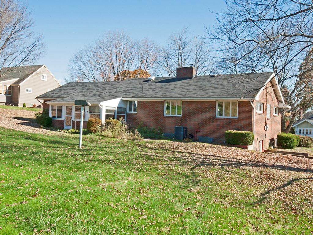 4456 Ellwood Road New Castle, PA 16101 - Photo 3 of 25 Rear view of home featuring enclosed back porch.