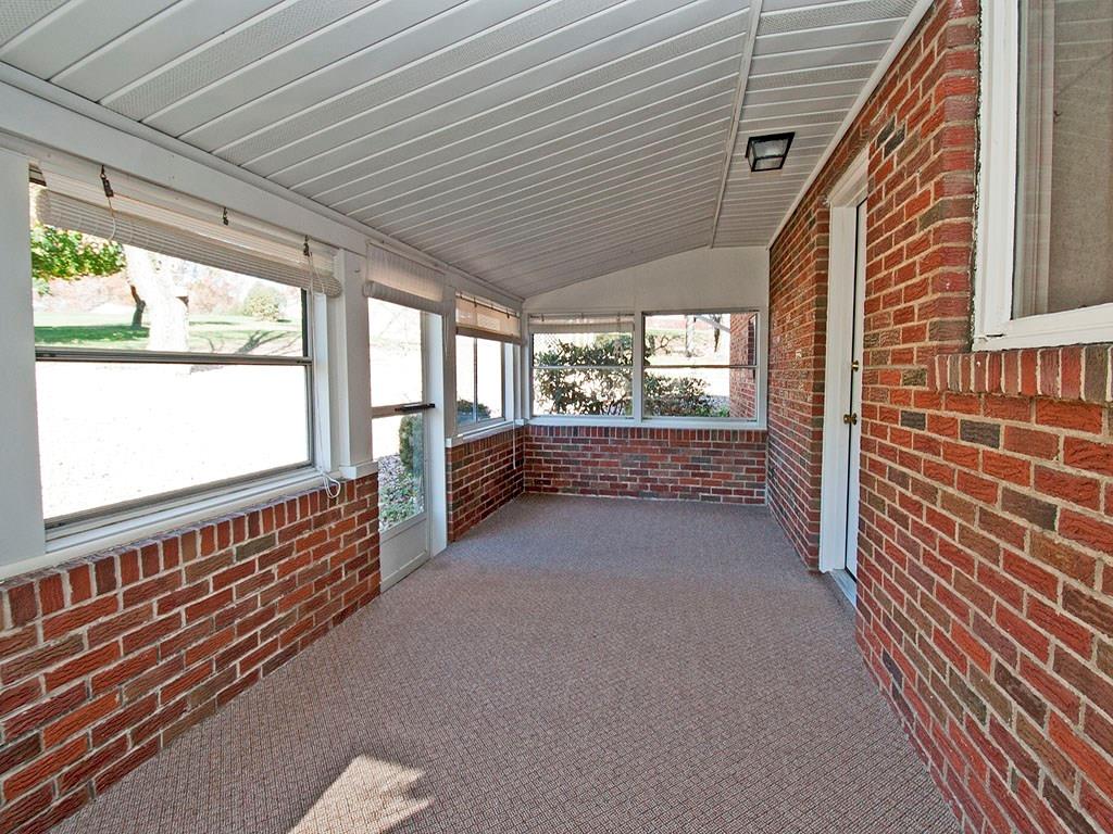 4456 Ellwood Road New Castle, PA 16101 - Photo 21 of 25 The enclosed porch overlooks the private backyard, fields and countryside.