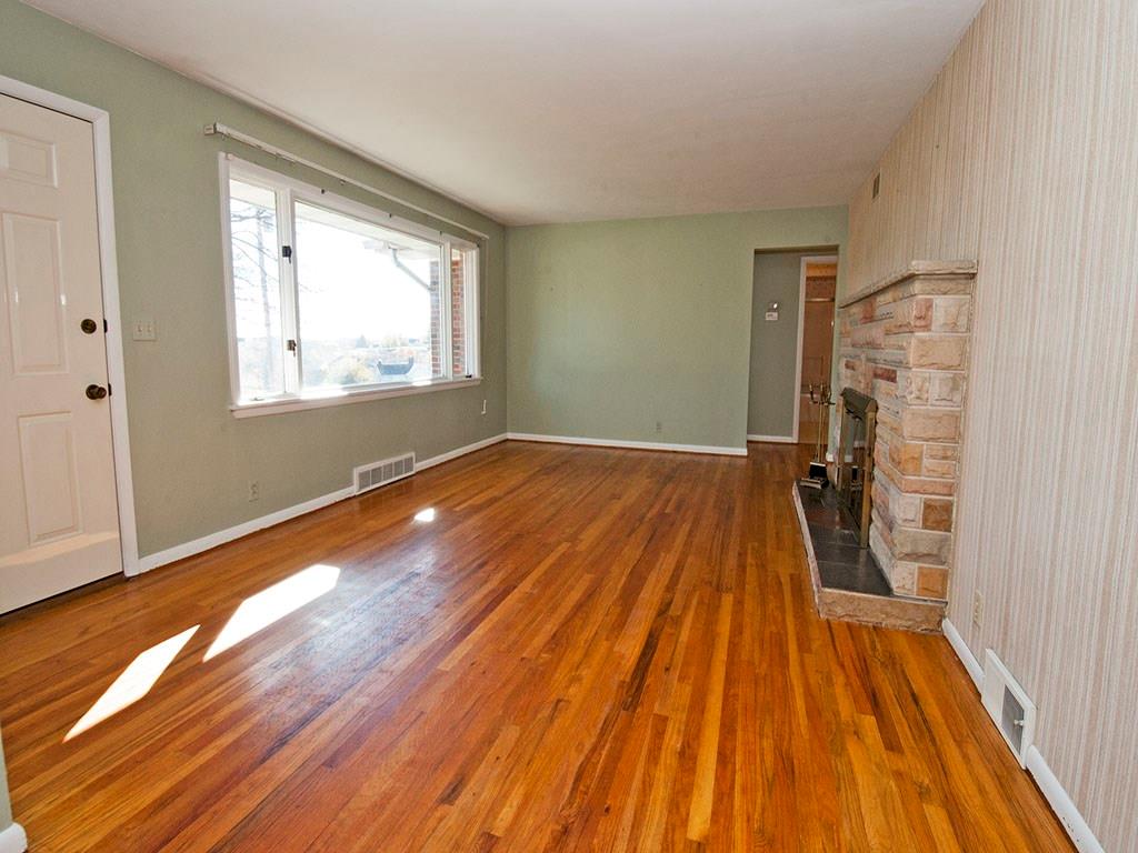 4456 Ellwood Road New Castle, PA 16101 - Photo 4 of 25 Living room features original hardwood floors.