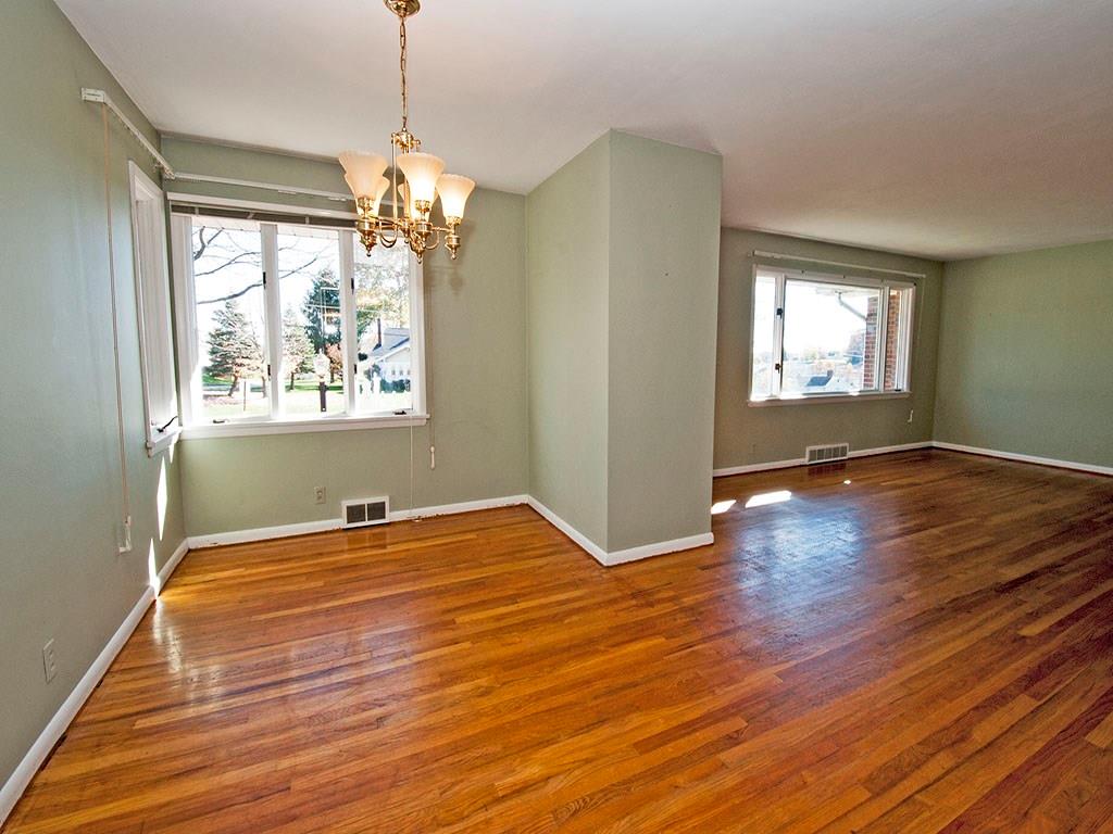 4456 Ellwood Road New Castle, PA 16101 - Photo 7 of 25 The open concept floor plan connects the dining and living space.