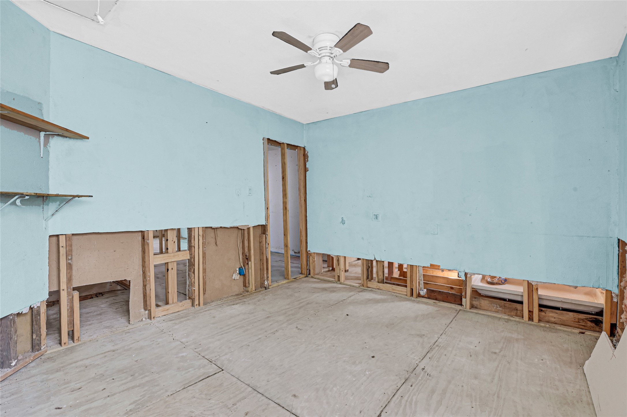 1925 Sunny Drive Houston, TX 77093 - Photo 19 of 24 wooden floor with windows and ceiling fan