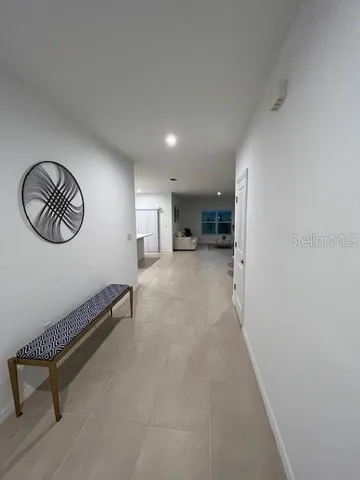 wooden floor with a rug and a chair