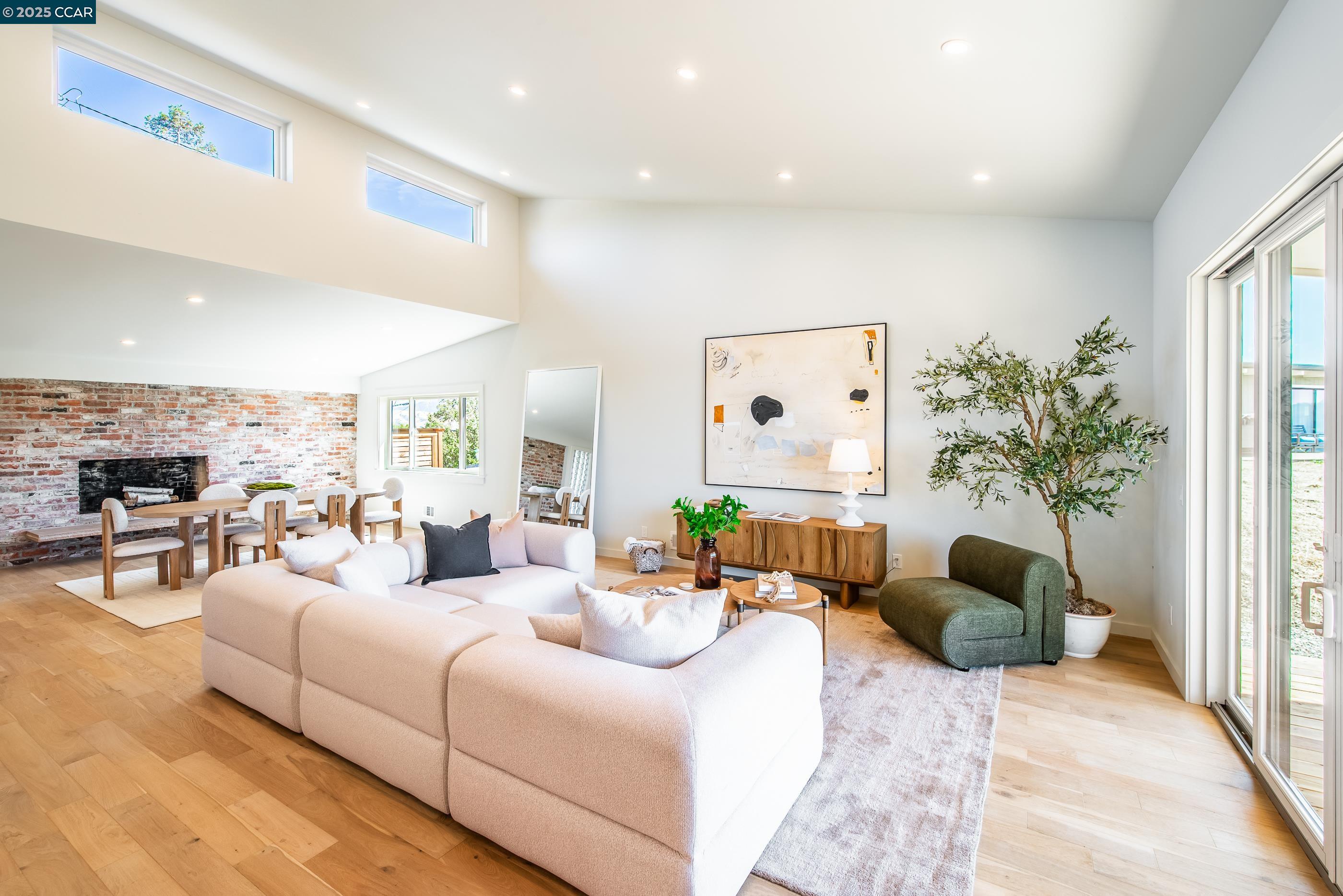 105 Hillcroft Way Walnut Creek, CA 94597 - Photo 15 of 56 a living room with furniture and a large window