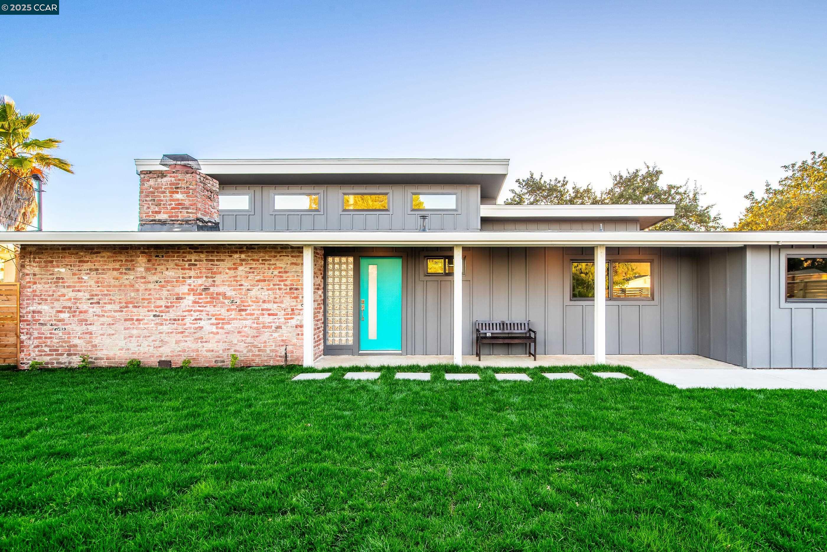 105 Hillcroft Way Walnut Creek, CA 94597 - Photo 2 of 56 a front view of a house with a yard and fountain