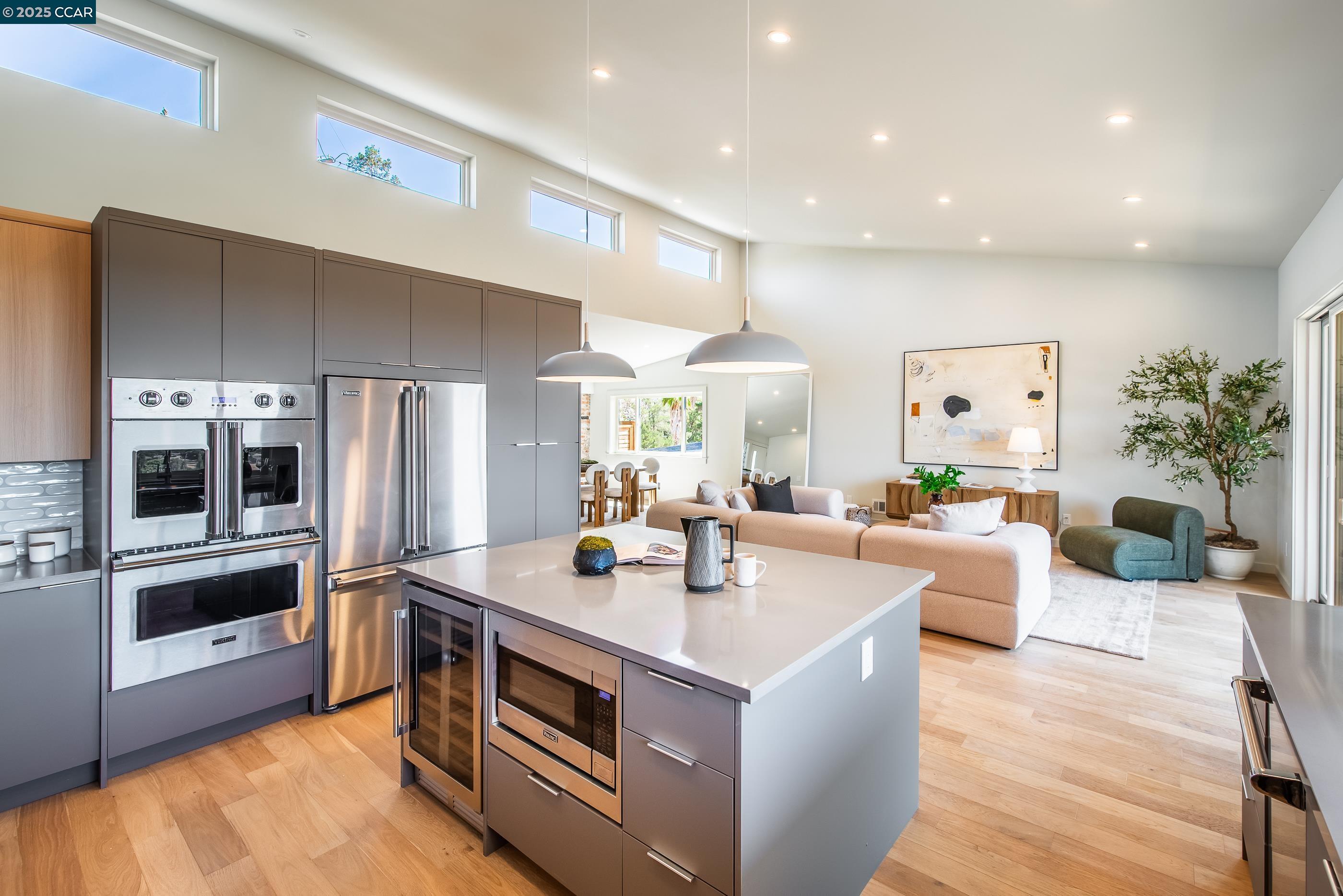 105 Hillcroft Way Walnut Creek, CA 94597 - Photo 23 of 56 a view of kitchen with kitchen island stainless steel appliances a sink and living room view