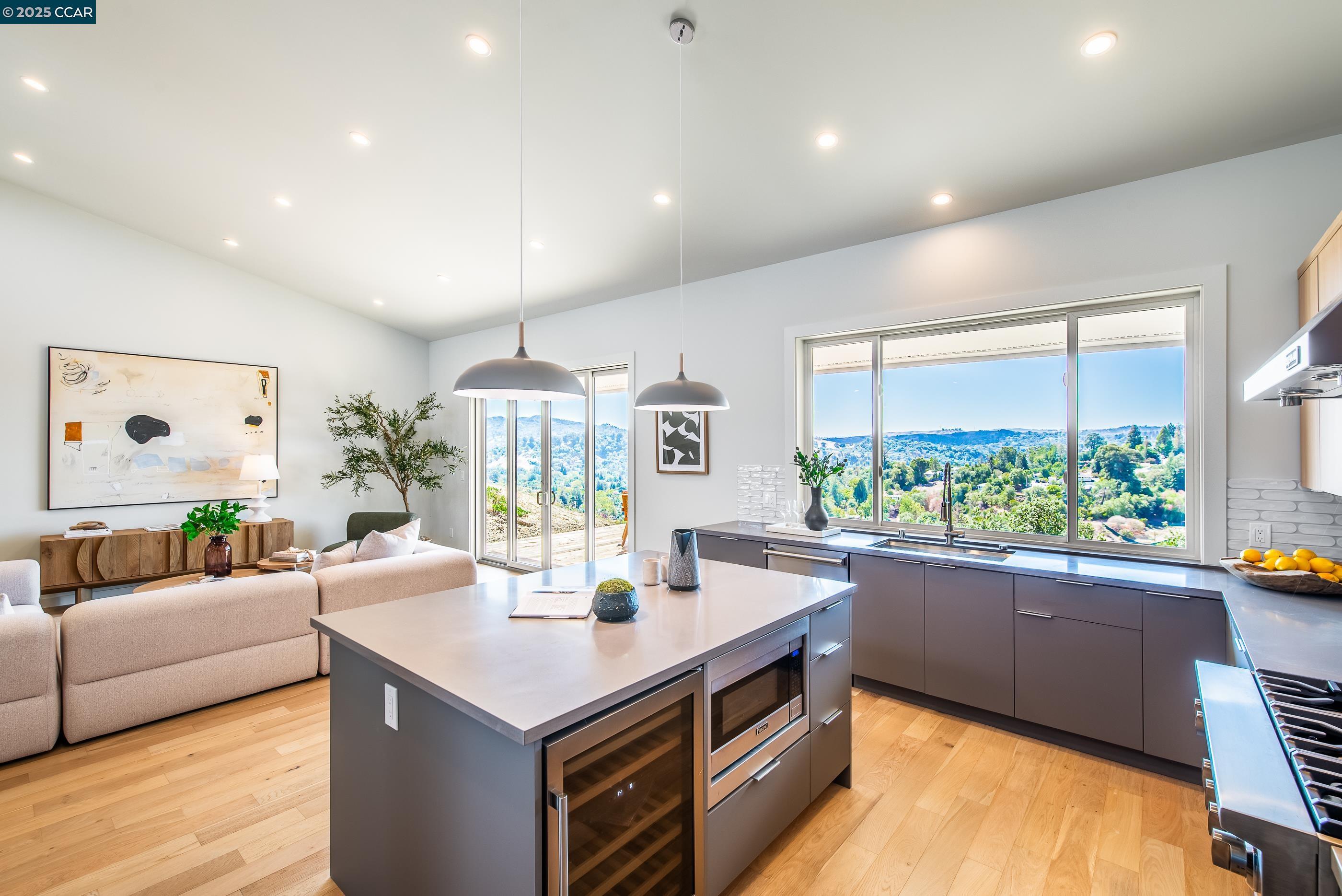 105 Hillcroft Way Walnut Creek, CA 94597 - Photo 26 of 56 a living room with stainless steel appliances kitchen island furniture and a large window