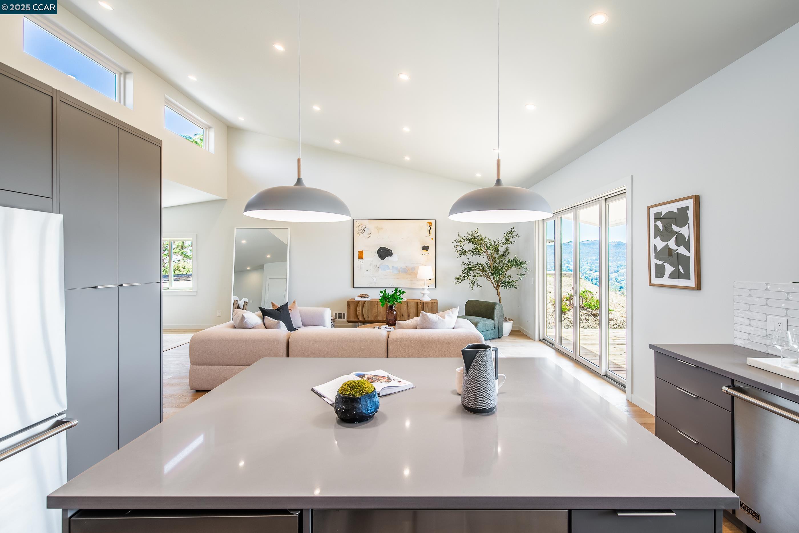 105 Hillcroft Way Walnut Creek, CA 94597 - Photo 27 of 56 a dining room with wooden floor and chandelier