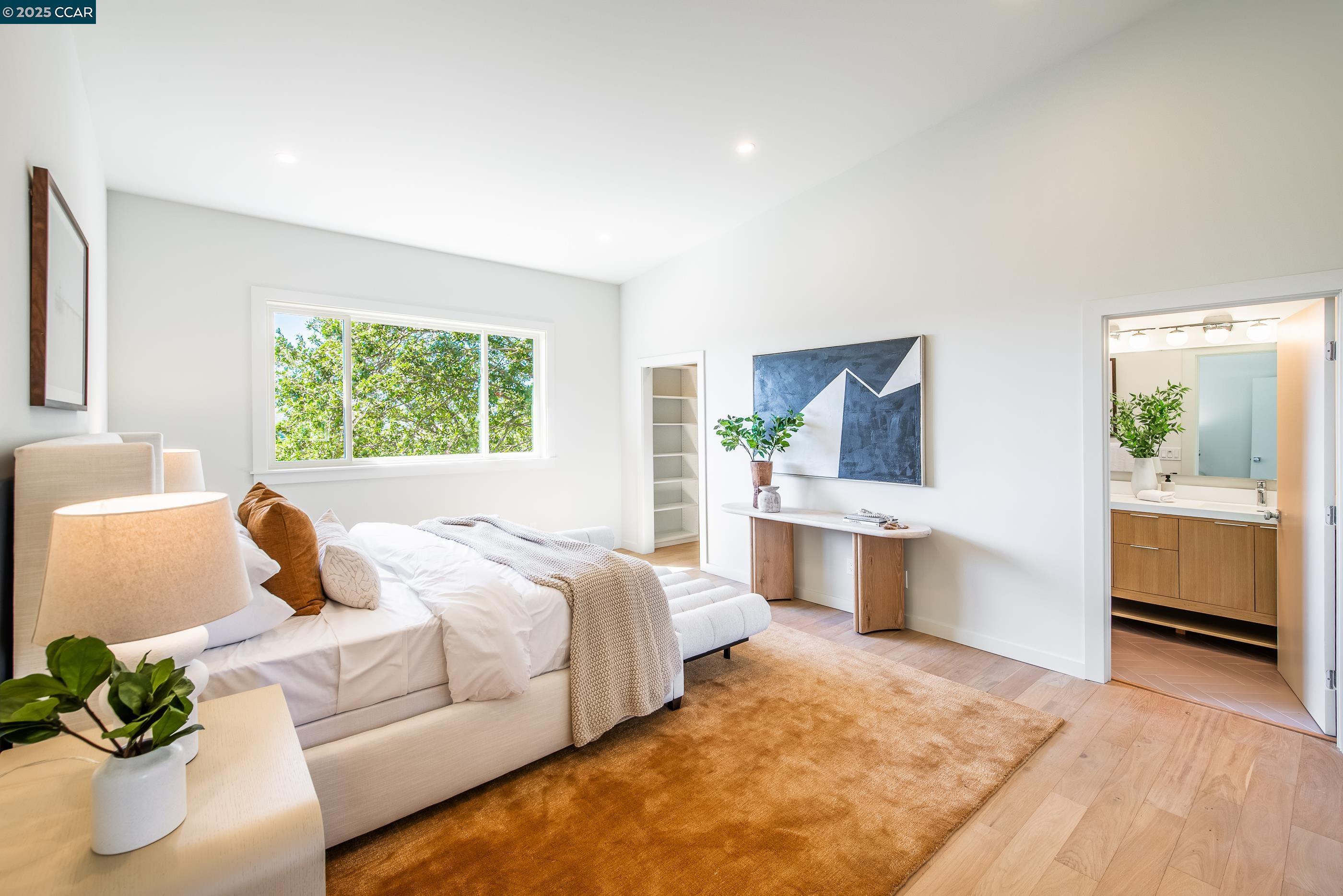 105 Hillcroft Way Walnut Creek, CA 94597 - Photo 28 of 56 a bedroom with a large bed and a couch