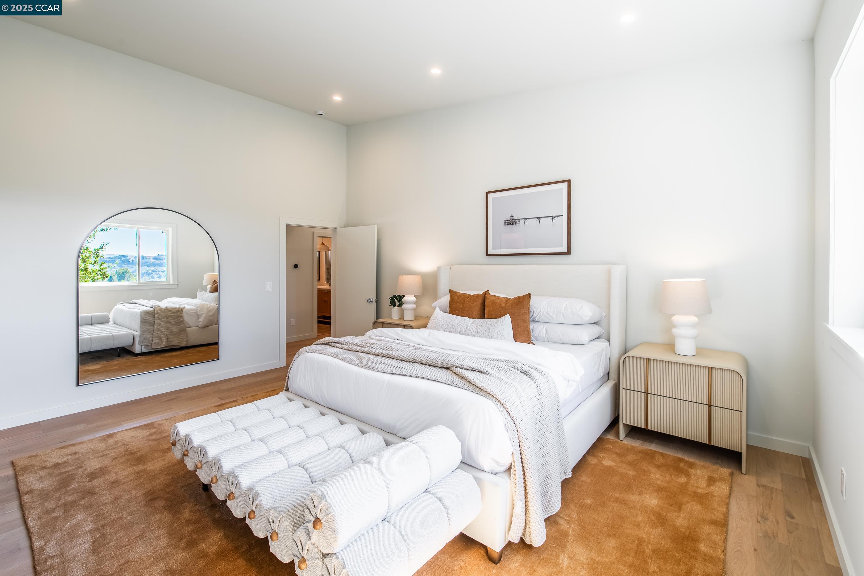 105 Hillcroft Way Walnut Creek, CA 94597 - Photo 30 of 56 a spacious bedroom with a bed and a couch