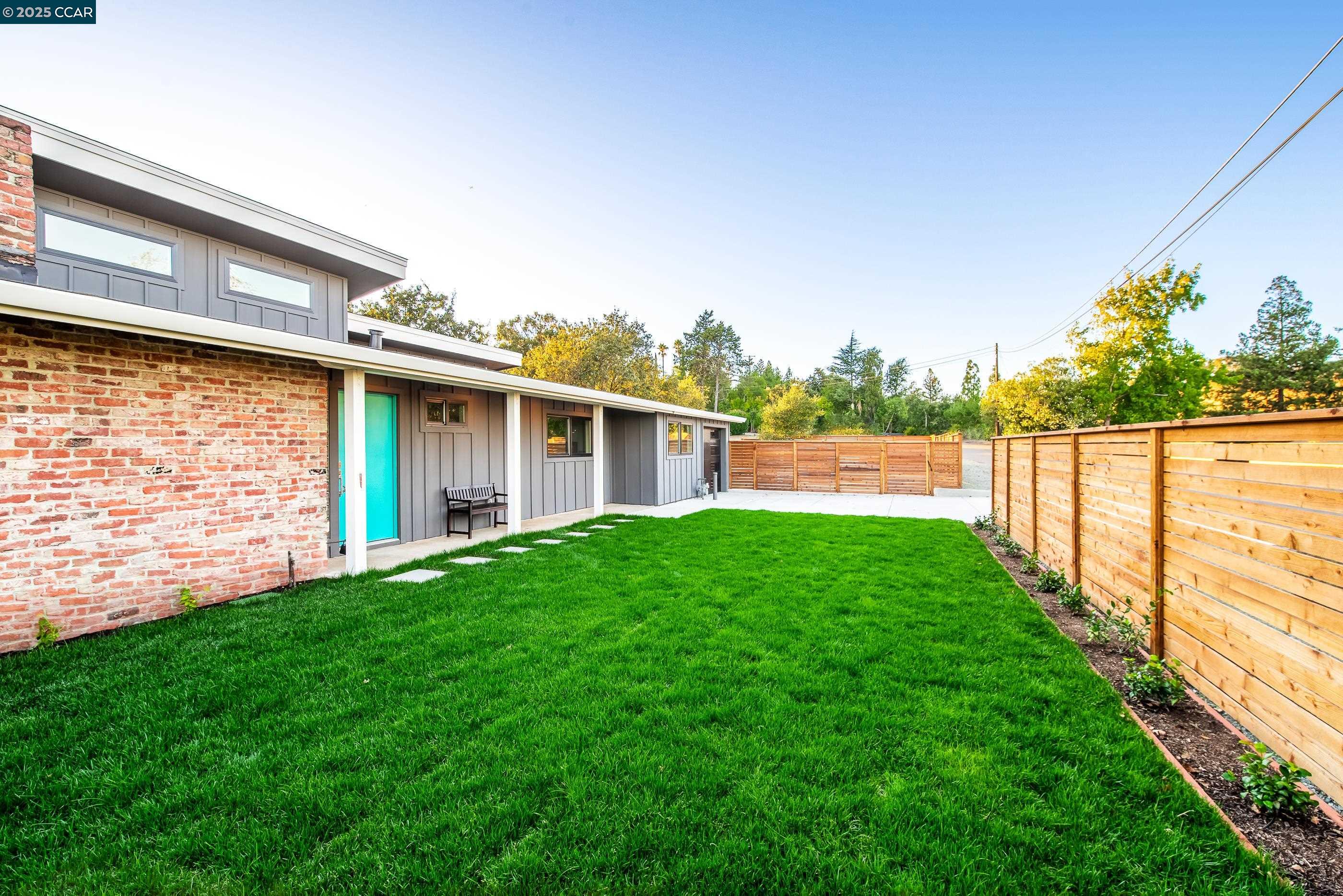 105 Hillcroft Way Walnut Creek, CA 94597 - Photo 3 of 56 a view of a house with a yard and a garden
