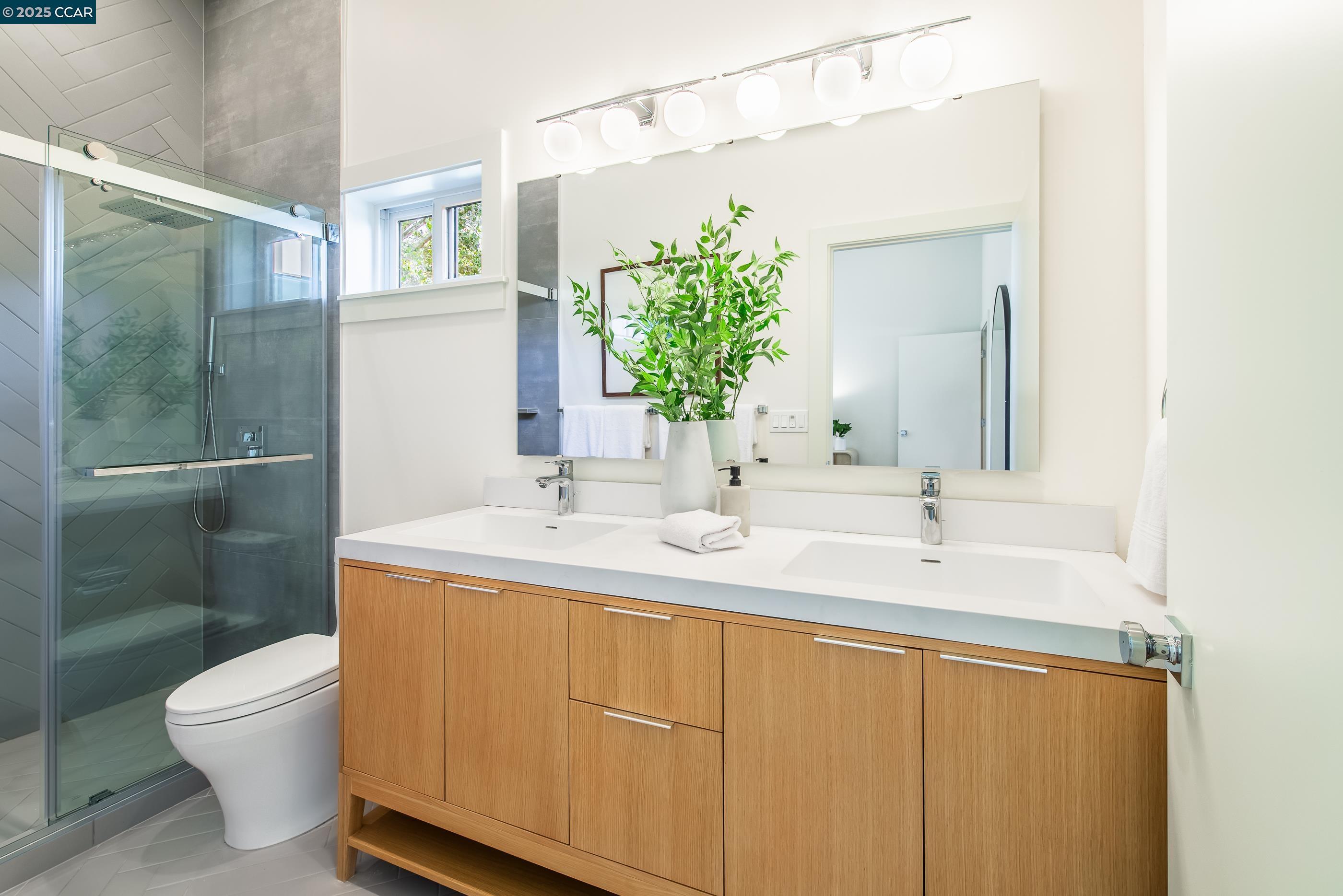 105 Hillcroft Way Walnut Creek, CA 94597 - Photo 32 of 56 a bathroom with a toilet sink and mirror
