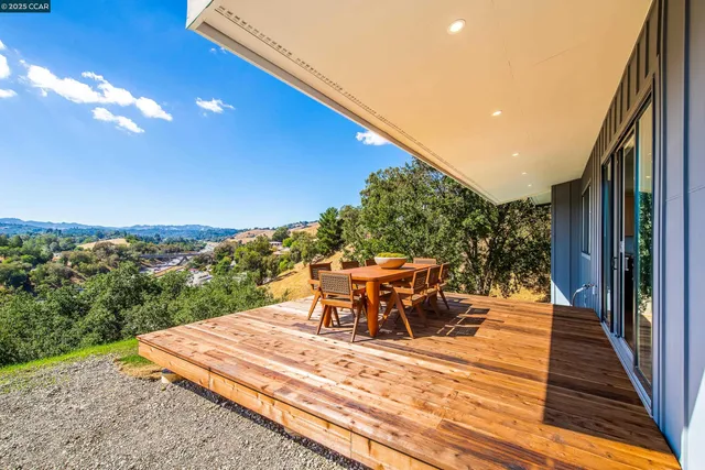 a view of a terrace with furniture and a table