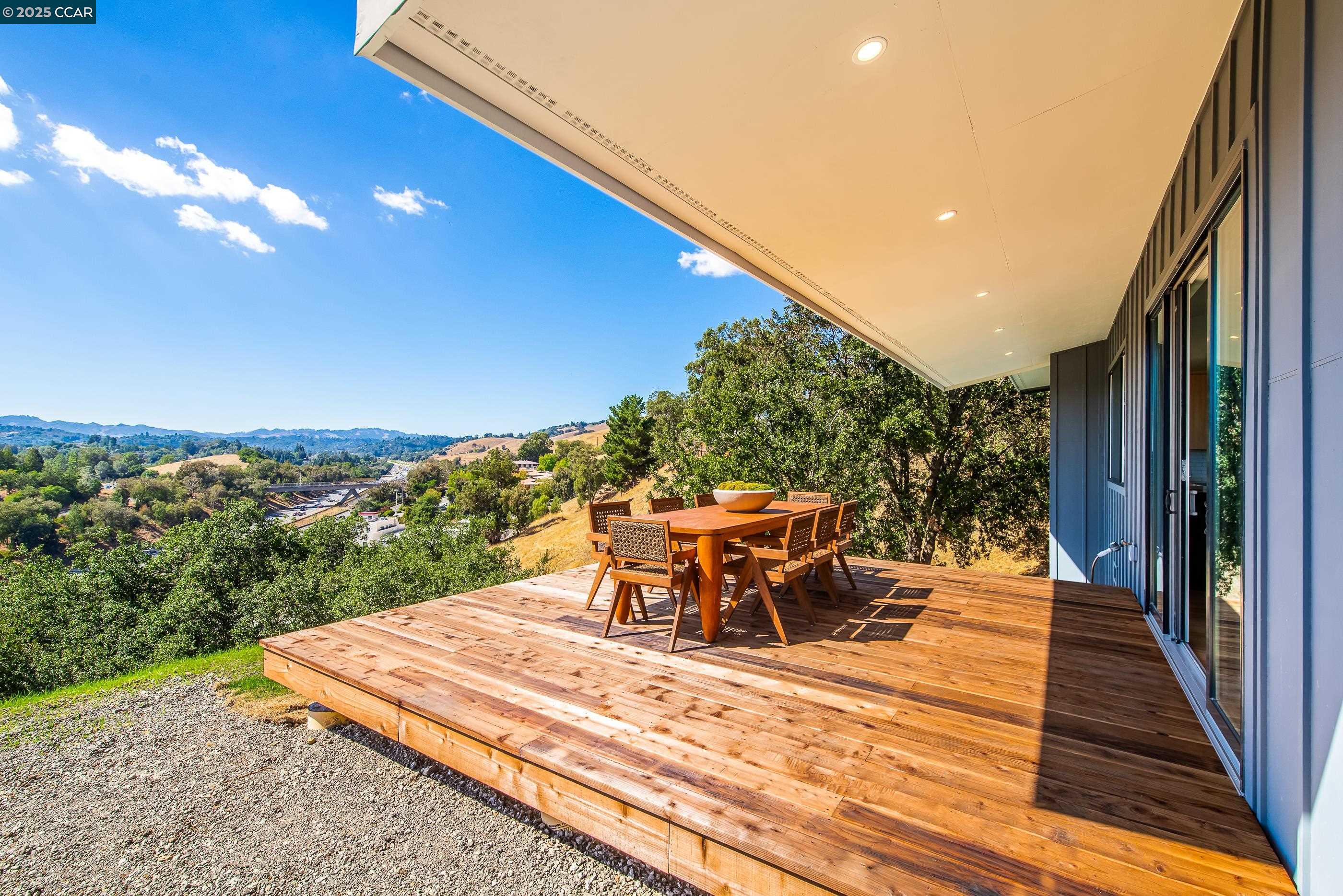 105 Hillcroft Way Walnut Creek, CA 94597 - Photo 41 of 56 a view of a patio with a table and chairs