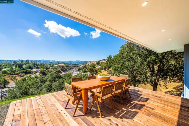 a view of a patio with chairs and a table