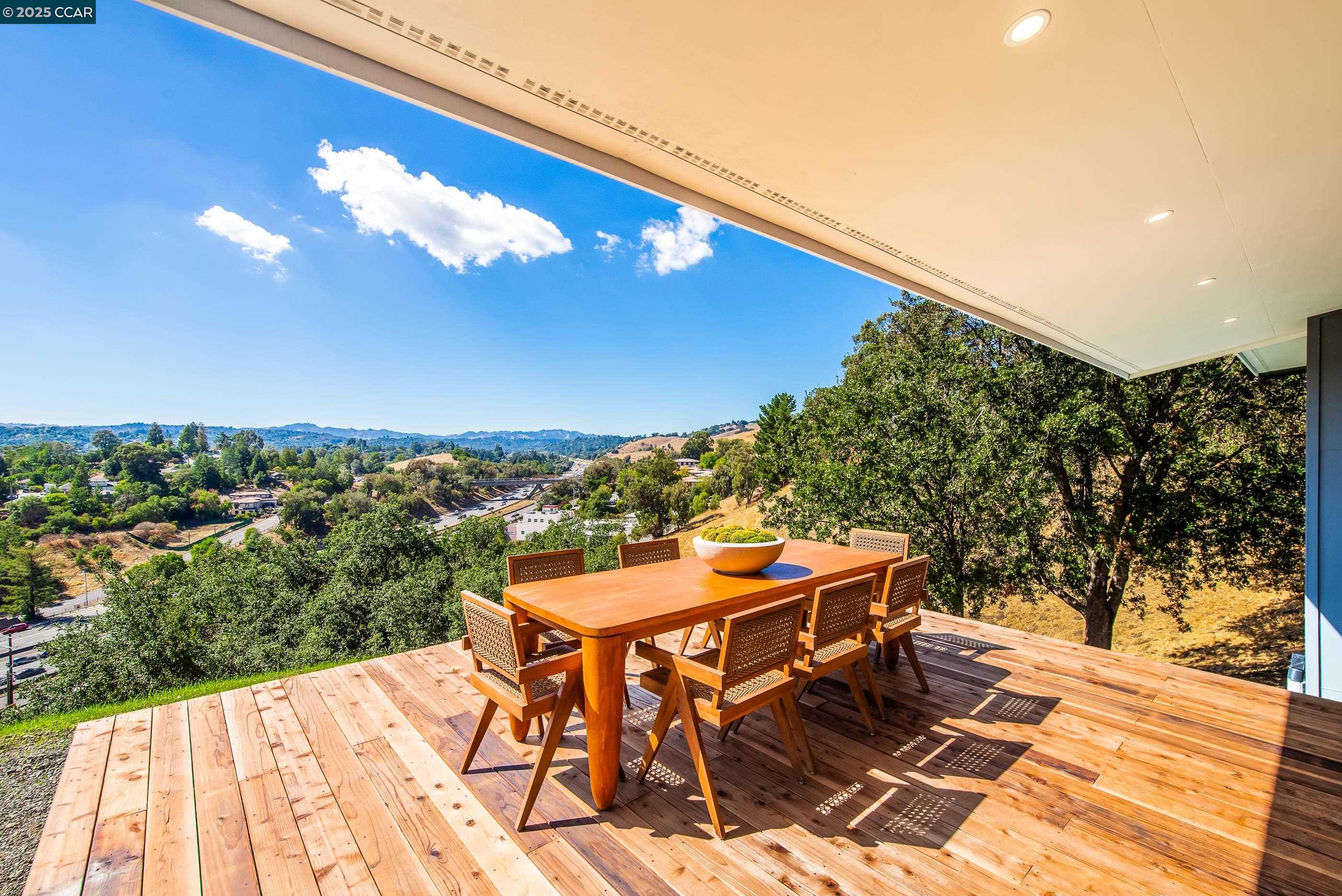 105 Hillcroft Way Walnut Creek, CA 94597 - Photo 42 of 56 a terrace with outdoor seating and city view
