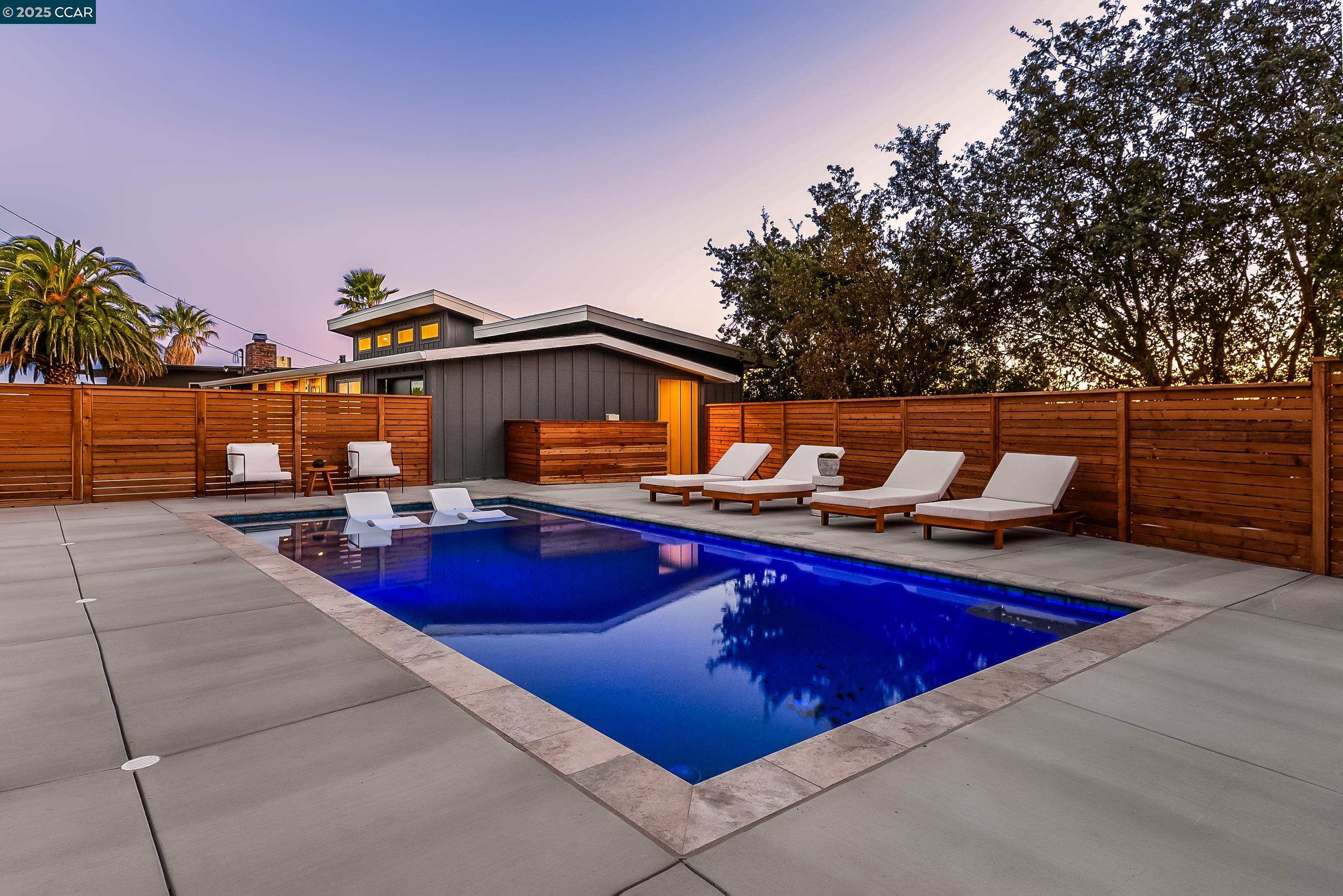 105 Hillcroft Way Walnut Creek, CA 94597 - Photo 49 of 56 a view of swimming pool with outdoor seating and plants