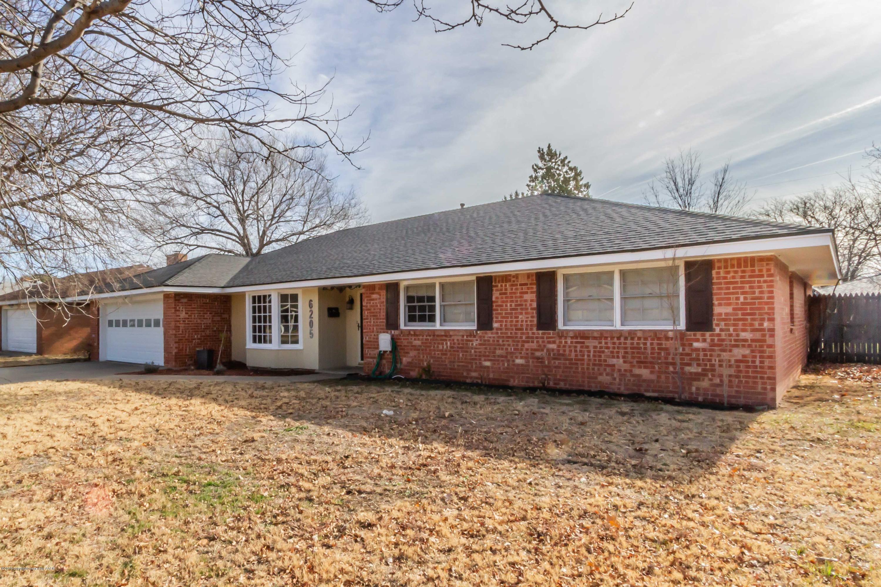 6205 Calumet Road Amarillo, TX 79106 - Photo 1 of 39 a front view of a house with a yard