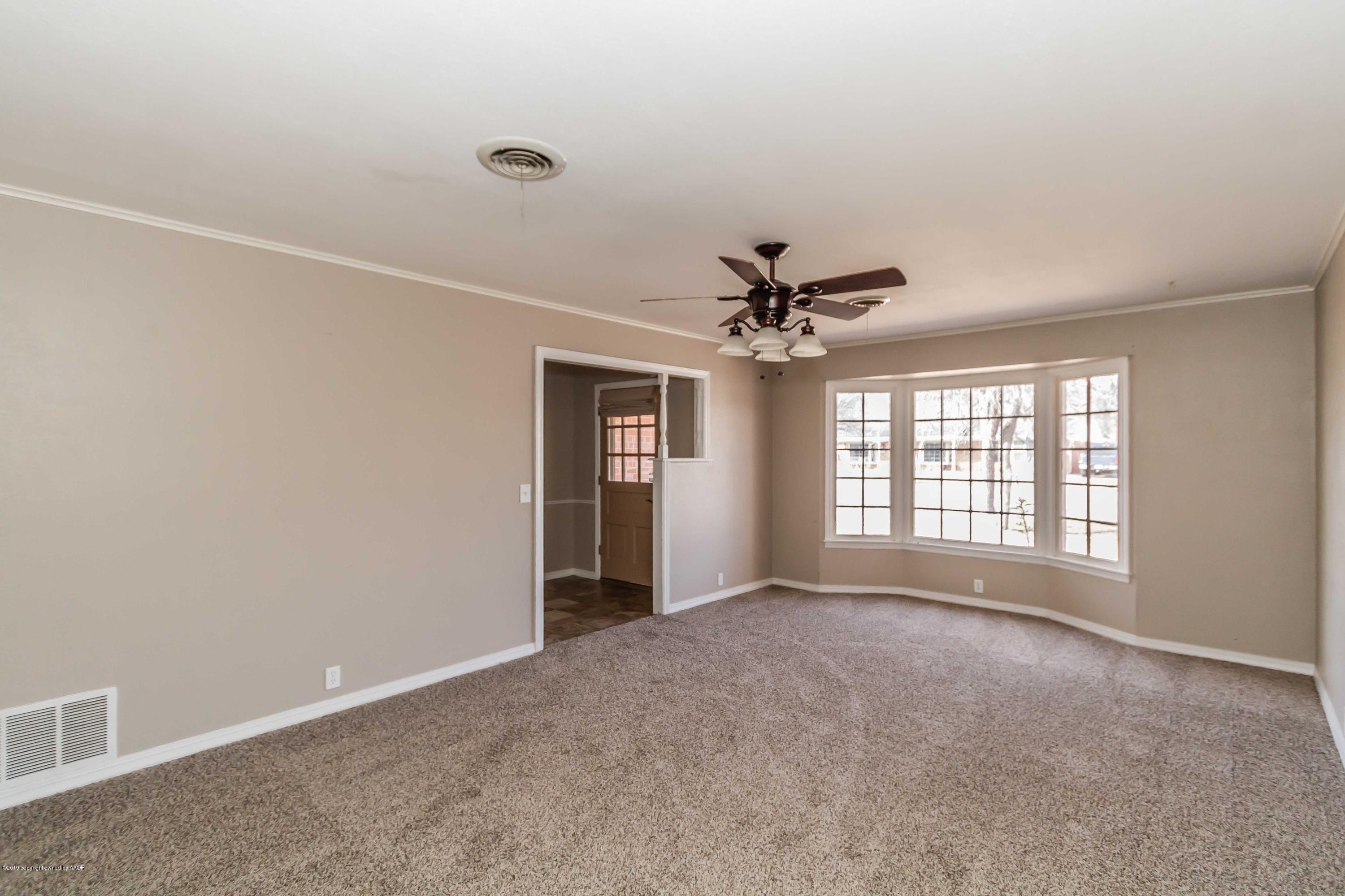 6205 Calumet Road Amarillo, TX 79106 - Photo 2 of 39 a view of an empty room with a window