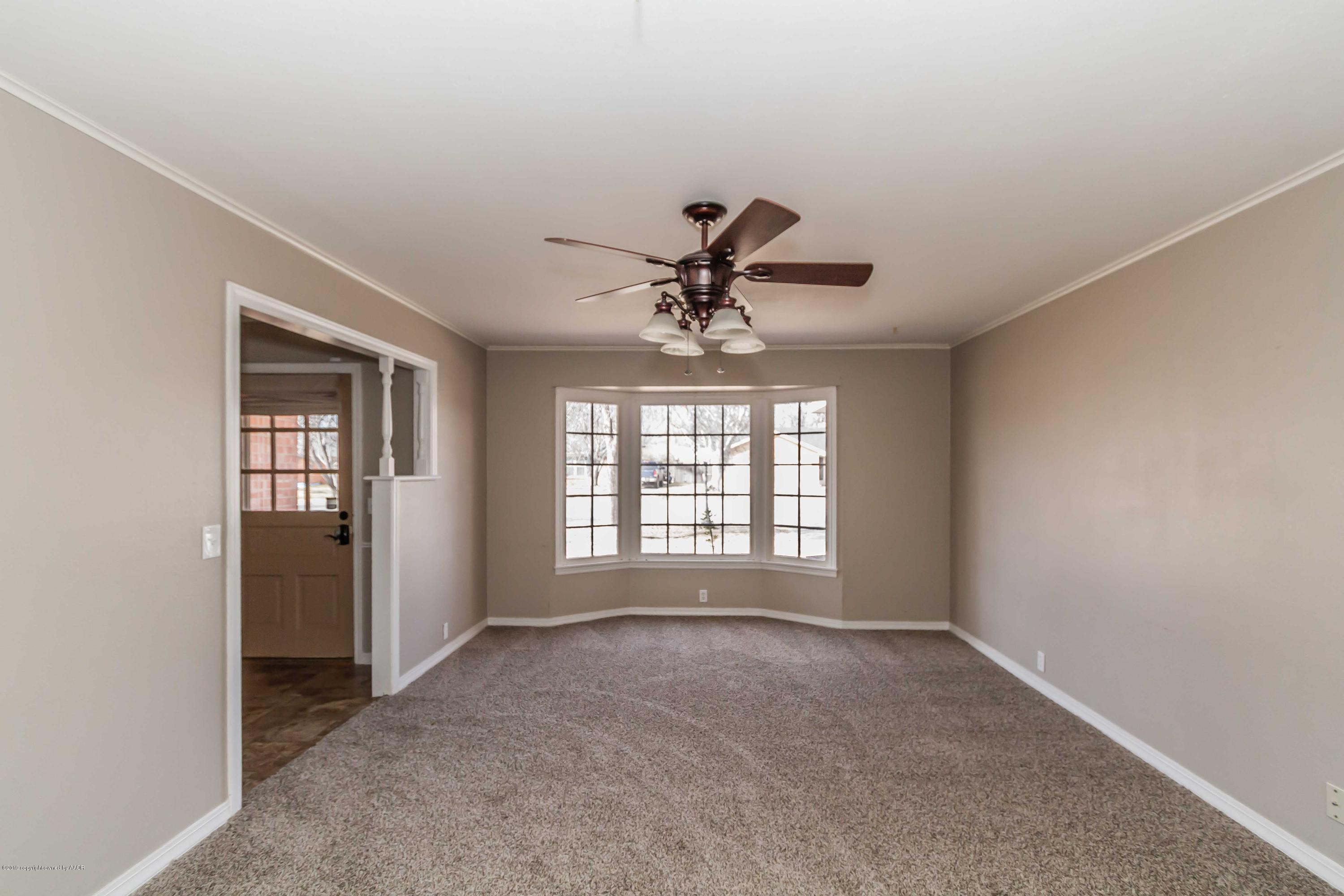 6205 Calumet Road Amarillo, TX 79106 - Photo 13 of 39 a view of an empty room with a window
