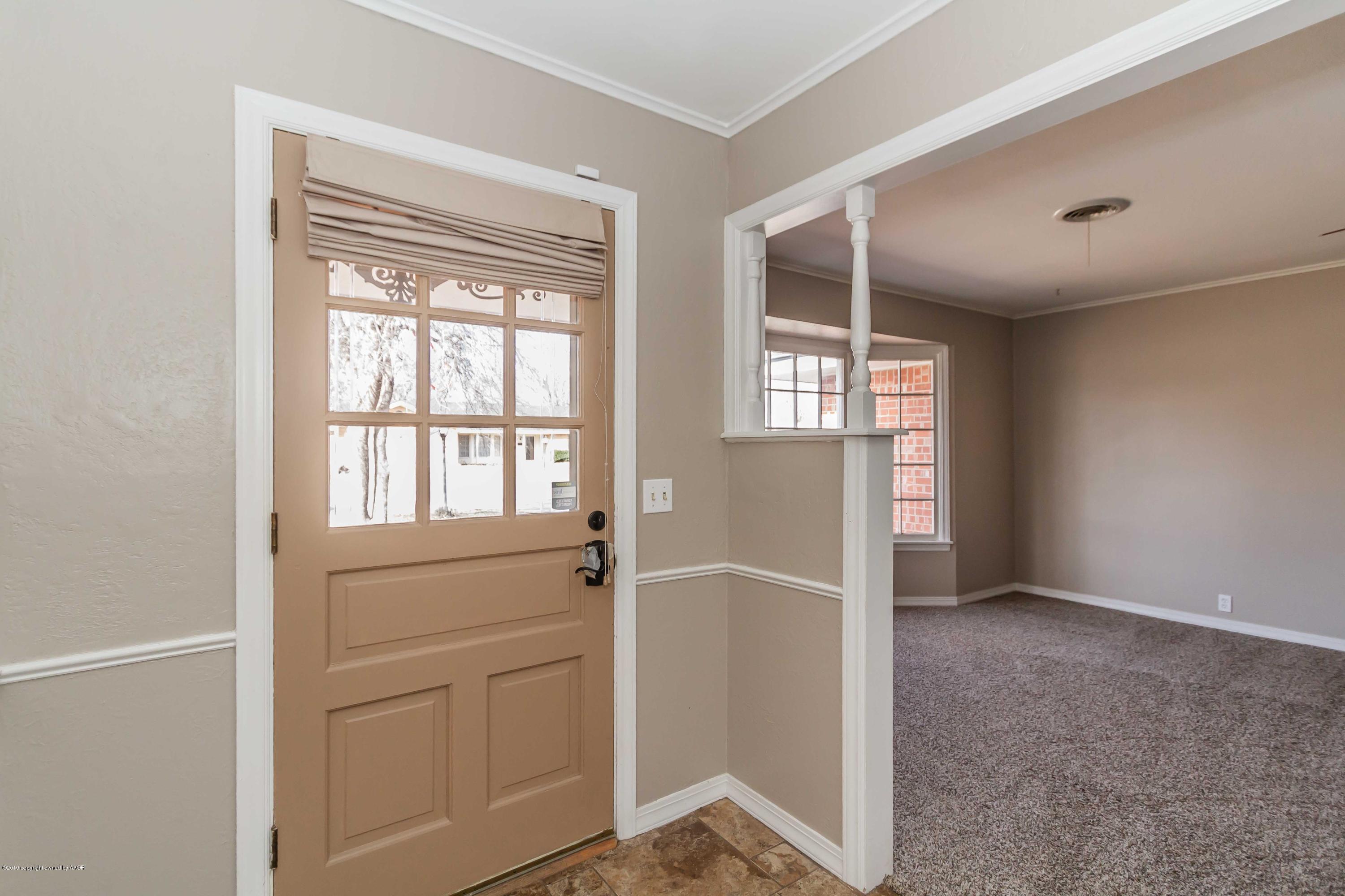6205 Calumet Road Amarillo, TX 79106 - Photo 14 of 39 an empty room with windows