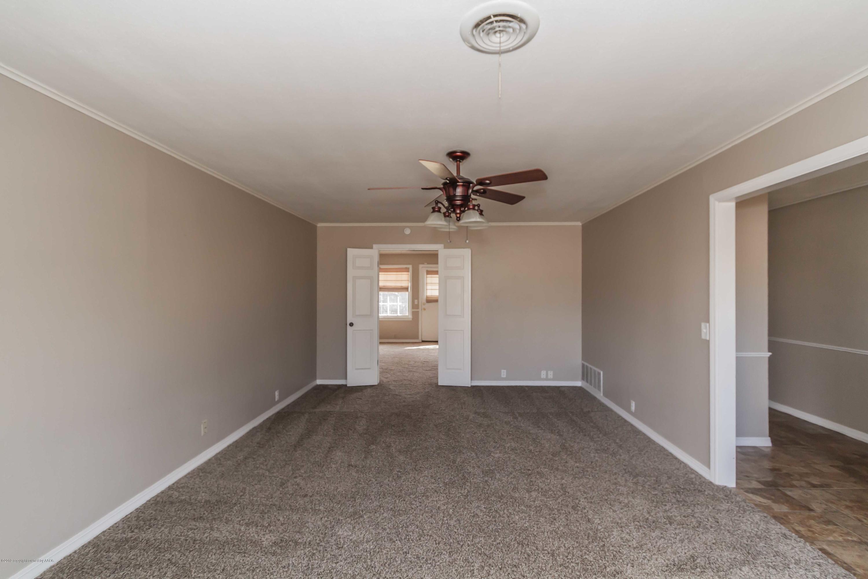 6205 Calumet Road Amarillo, TX 79106 - Photo 16 of 39 a view of an empty room with a window