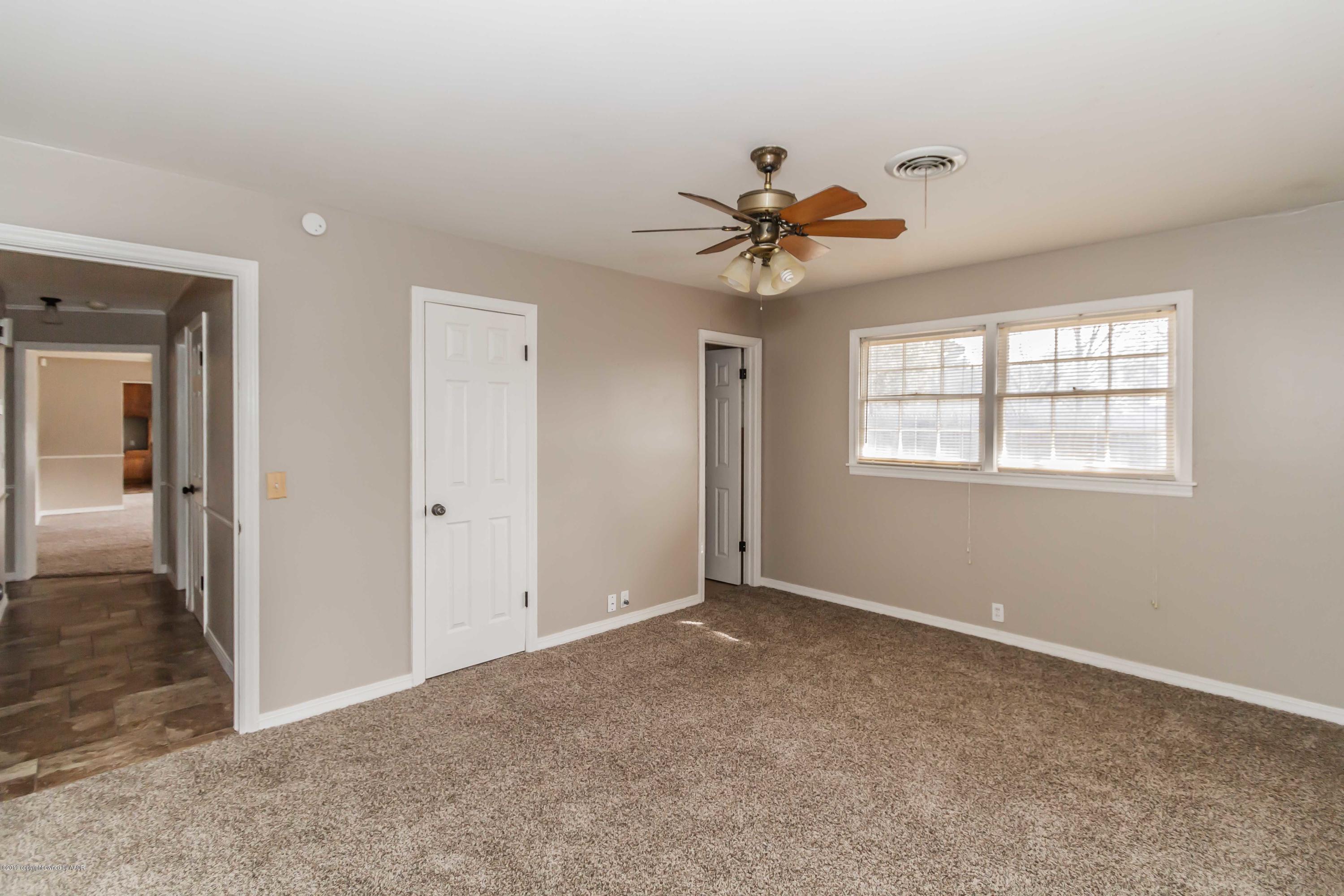 6205 Calumet Road Amarillo, TX 79106 - Photo 22 of 39 a view of an empty room with a window