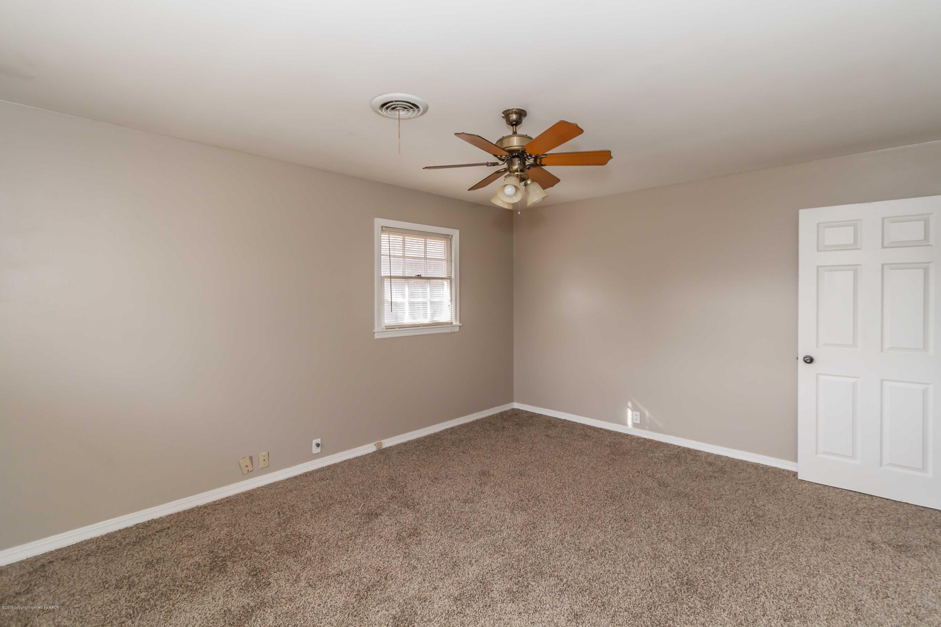 6205 Calumet Road Amarillo, TX 79106 - Photo 24 of 39 a view of room with a ceiling fan and window