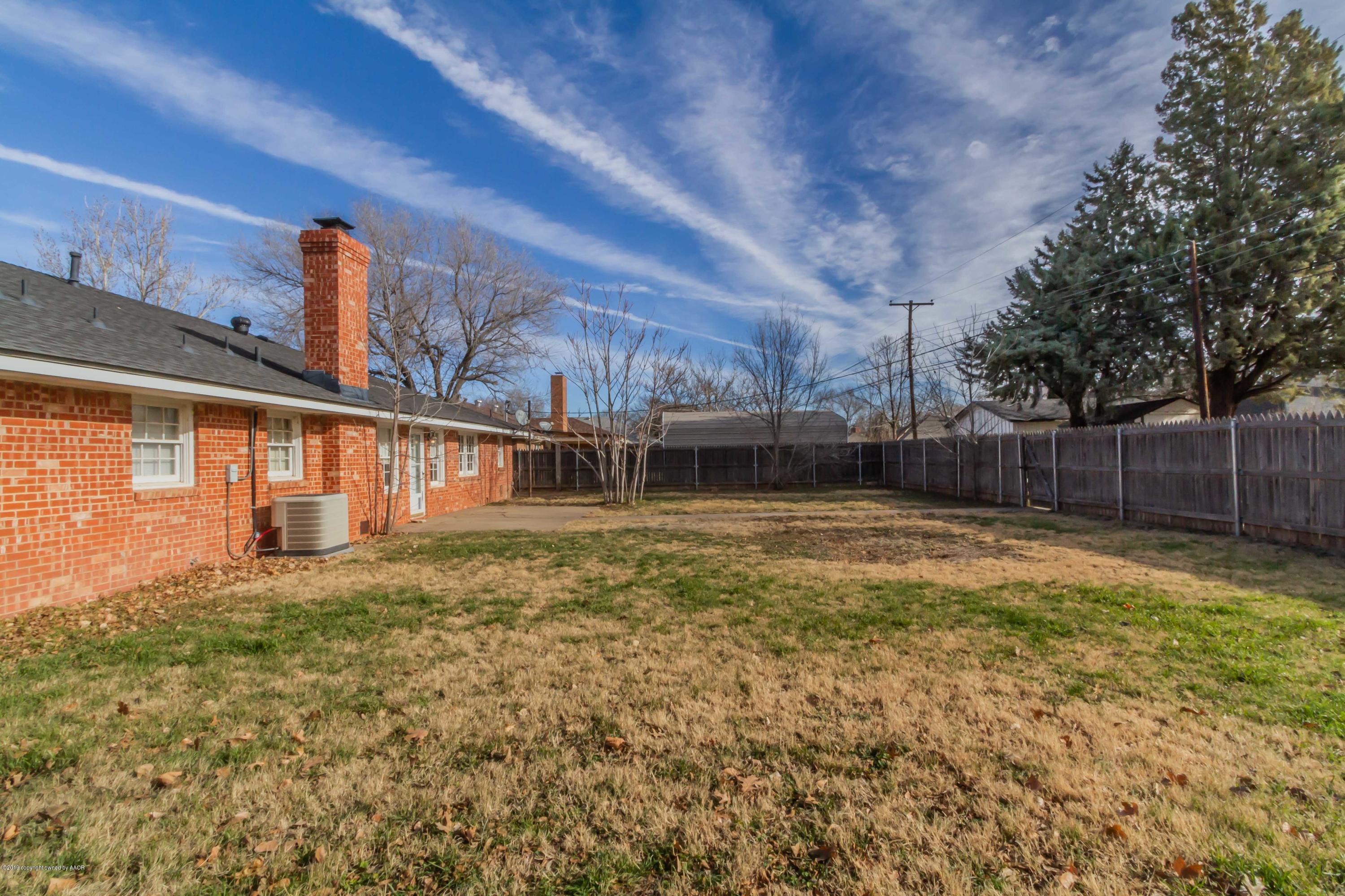 6205 Calumet Road Amarillo, TX 79106 - Photo 37 of 39 a view of a house with a backyard
