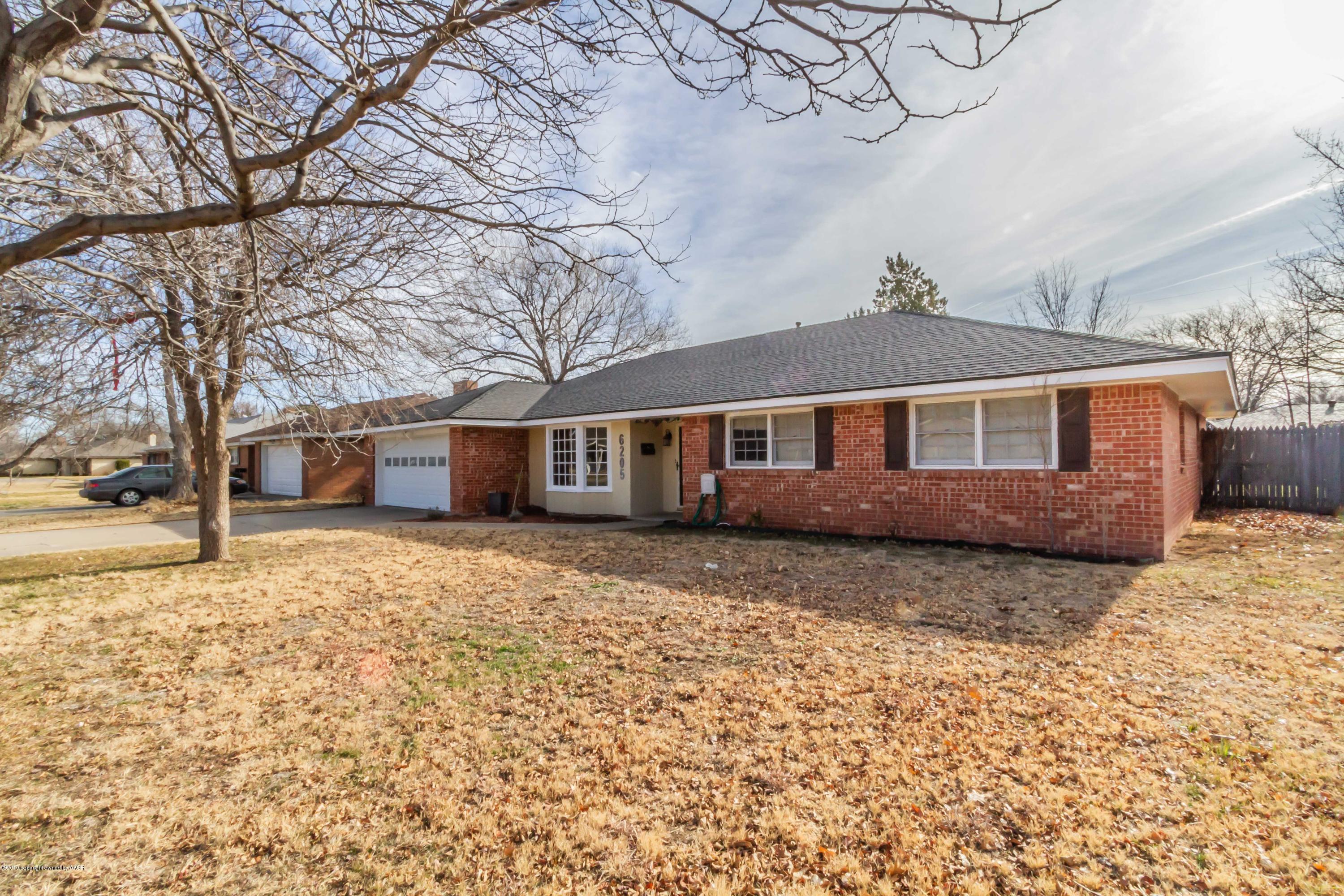 6205 Calumet Road Amarillo, TX 79106 - Photo 39 of 39 a front view of a house with a yard