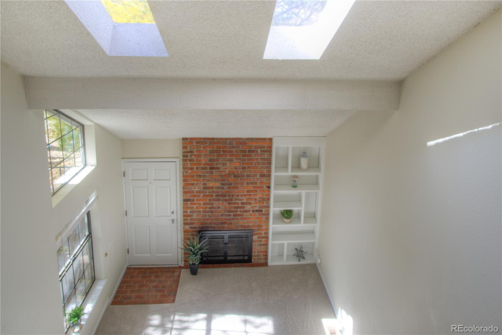 11781 West Elk Head Range Road Littleton, CO 80127 - Photo 16 of 48 a view of empty room with windows