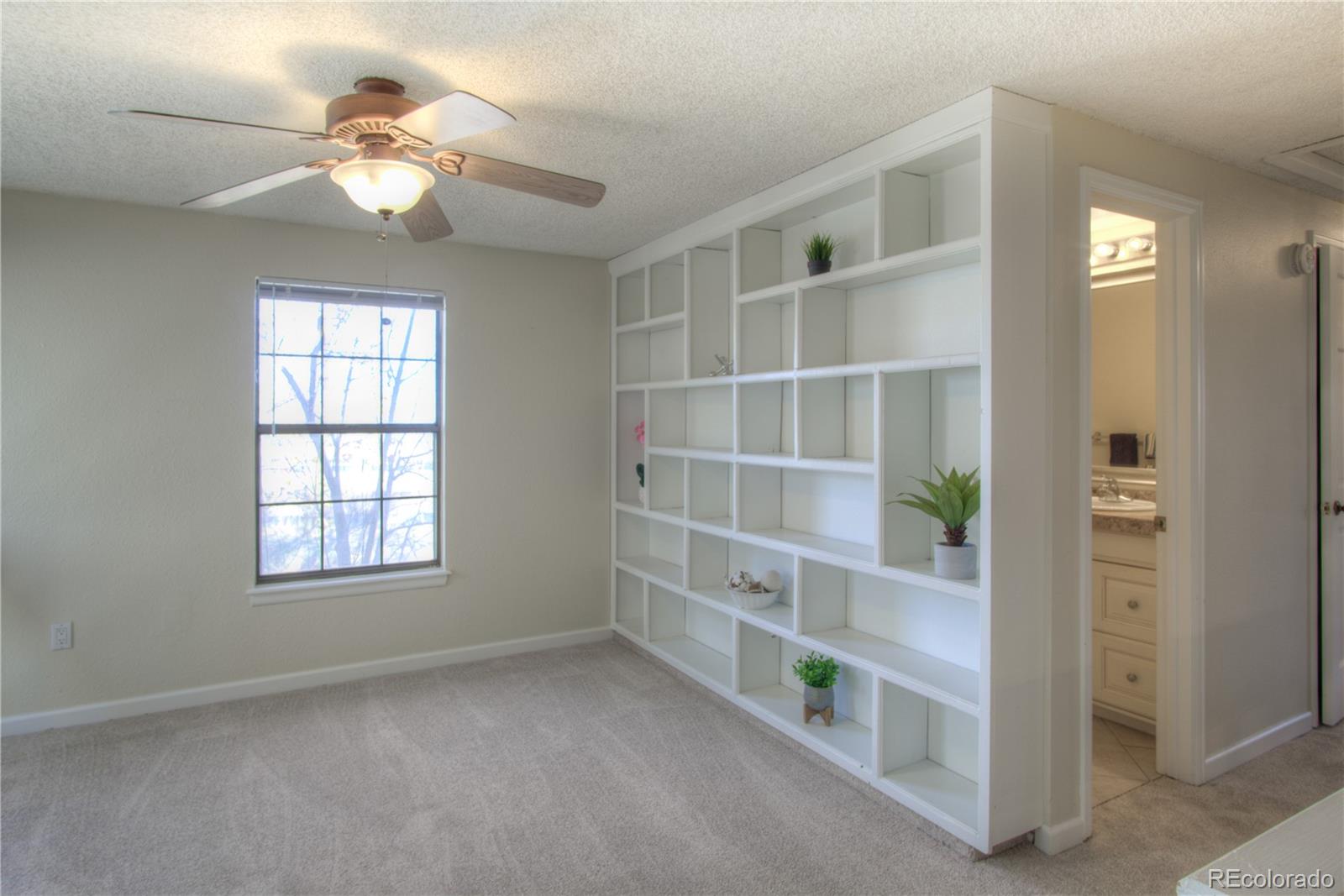 11781 West Elk Head Range Road Littleton, CO 80127 - Photo 17 of 48 a view of an empty room with a window