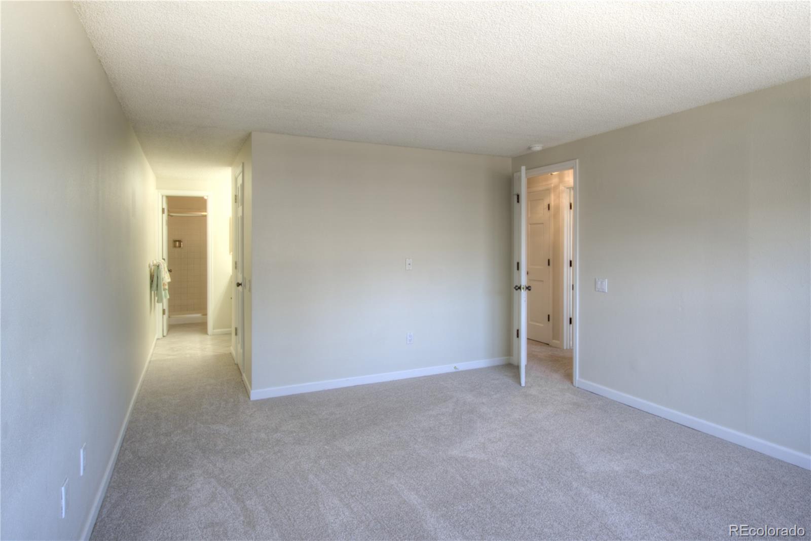 11781 West Elk Head Range Road Littleton, CO 80127 - Photo 20 of 48 a view of an empty room and a window