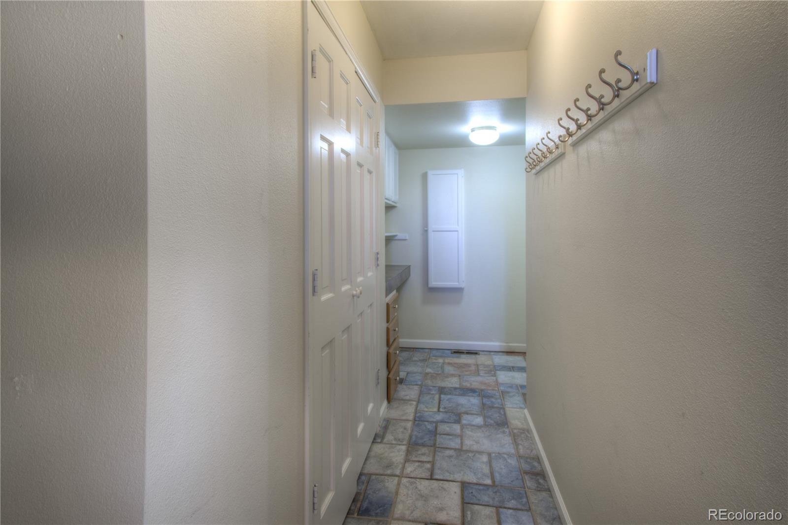 11781 West Elk Head Range Road Littleton, CO 80127 - Photo 29 of 48 a view of a hallway