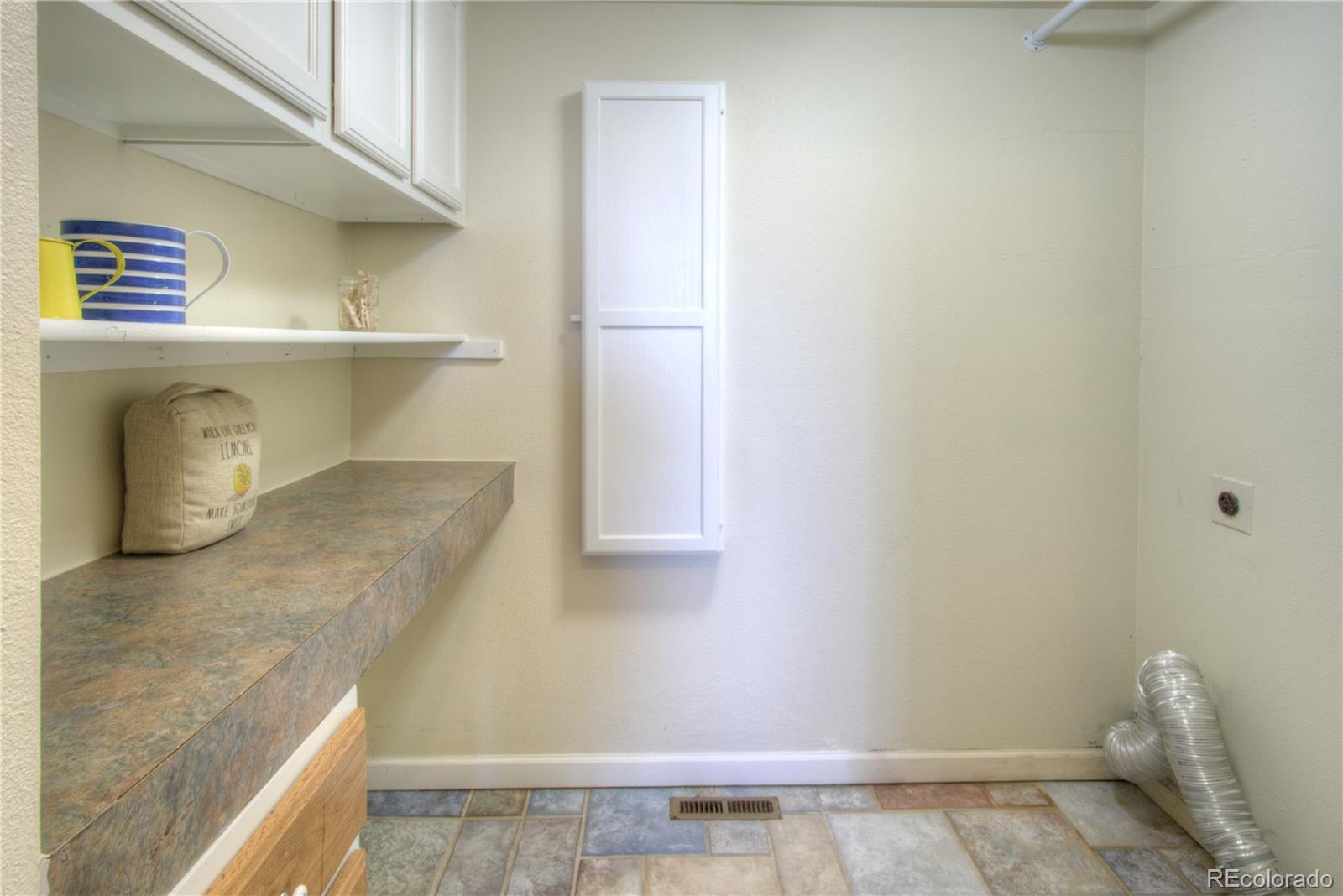 11781 West Elk Head Range Road Littleton, CO 80127 - Photo 30 of 48 a view of a kitchen cabinets
