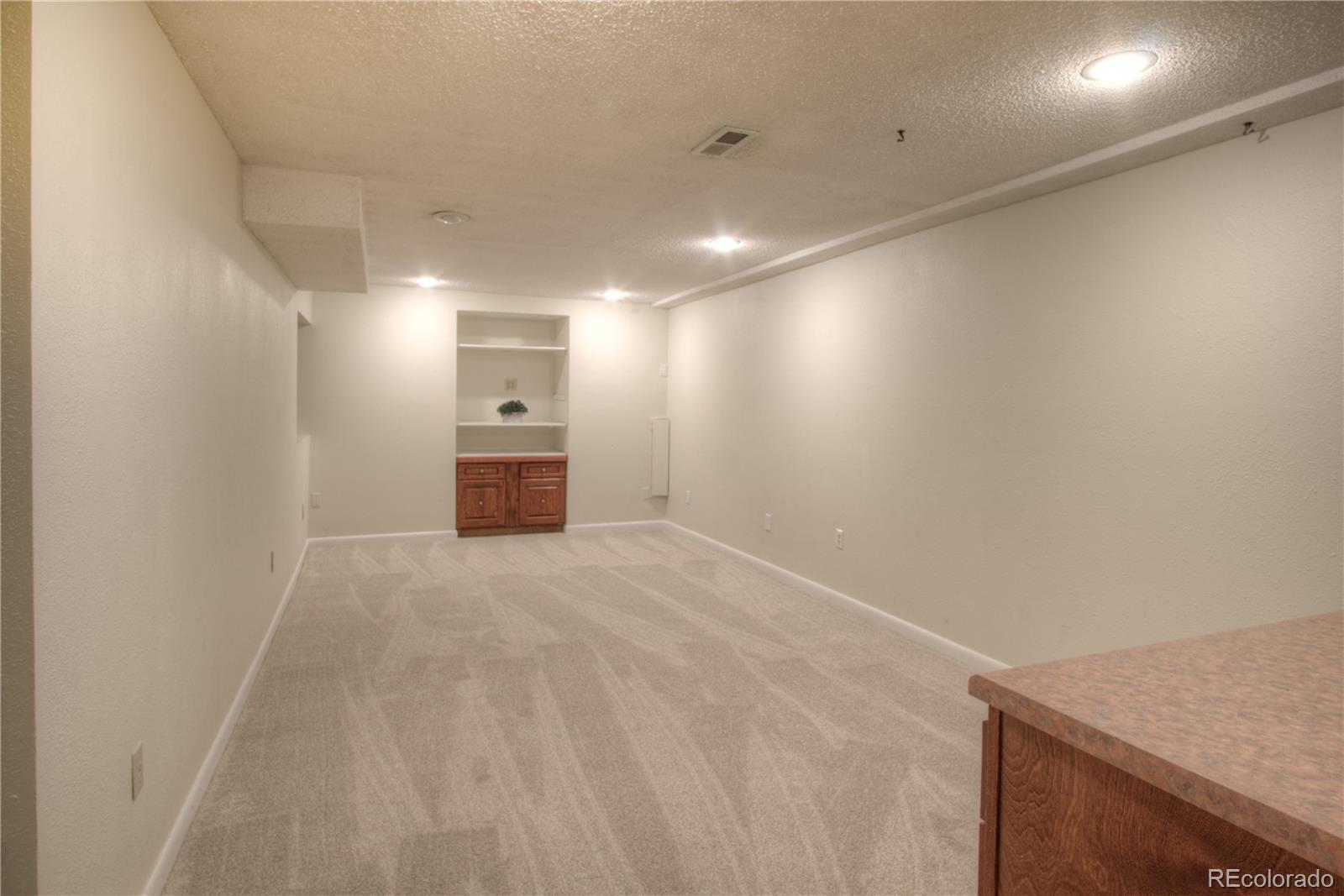 11781 West Elk Head Range Road Littleton, CO 80127 - Photo 32 of 48 a view of an empty room