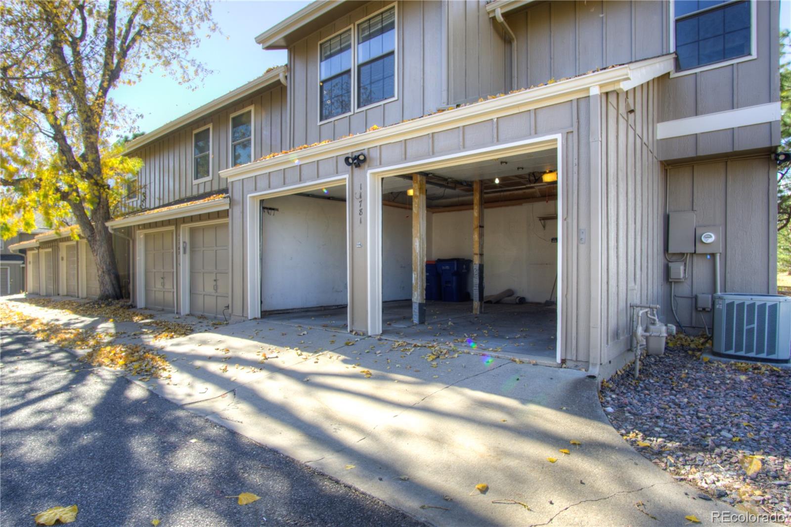 11781 West Elk Head Range Road Littleton, CO 80127 - Photo 38 of 48 a view of a house with a yard and garage