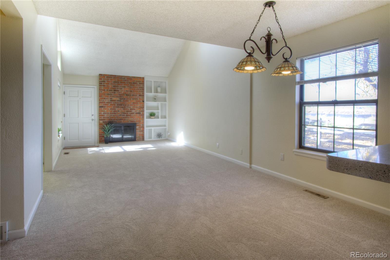 11781 West Elk Head Range Road Littleton, CO 80127 - Photo 5 of 48 a view of livingroom and window