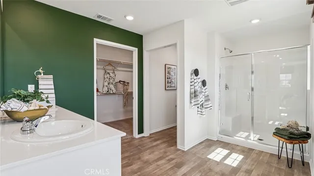 a bathroom with a sink and a shower